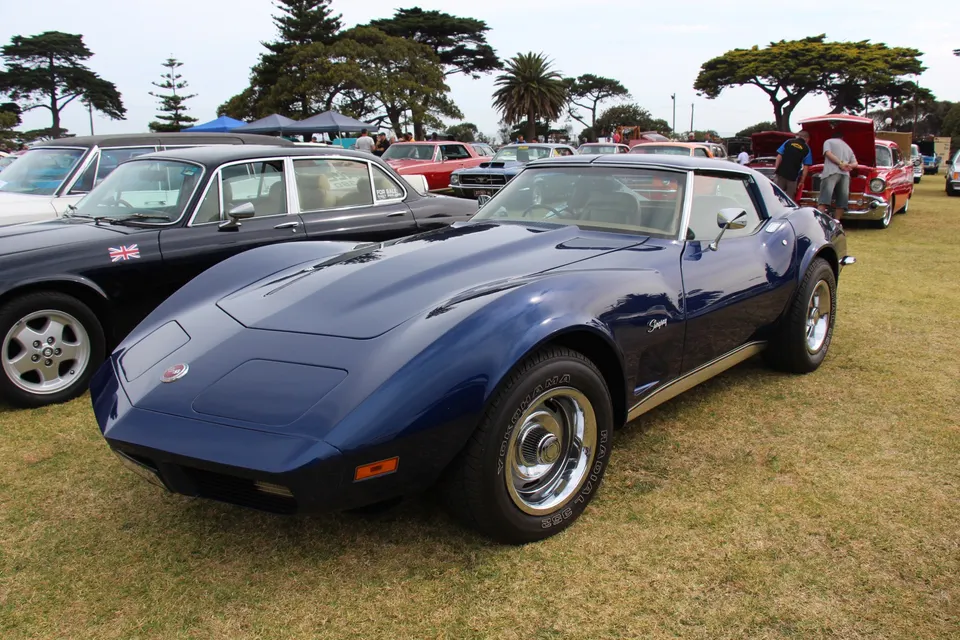 C3 fiberglass body with a body-color urethane front bumper and split chrome rear bumpers profile photo