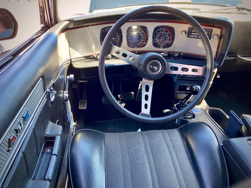 Engine-turned AMX dash and upper-door trim profile photo