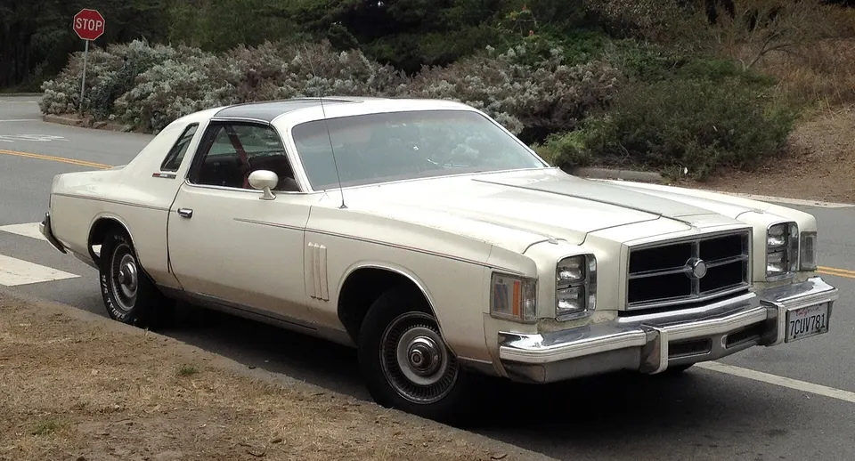 Optional ASC T-bar roof or power metal sunroof when supported by factory records profile photo