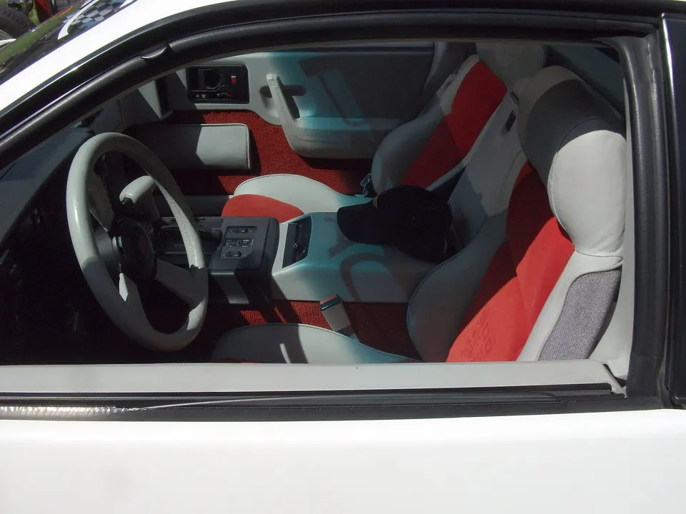 Two reclining high-back bucket seats with integral headrests profile photo