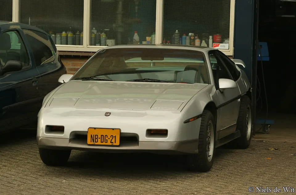 SE notchback aero body with rounded nose, rocker skirts, specific rear fascia, quad outlets, and optional D80 wing profile photo